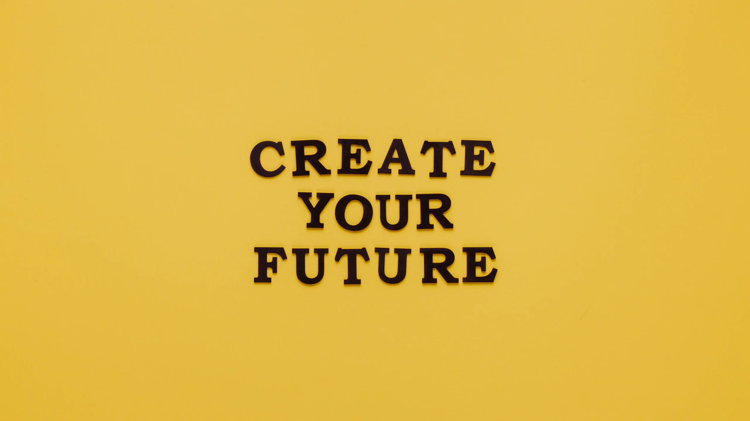 The phrase 'CREATE YOUR FUTURE' in bold letters against a yellow background, symbolizing the proactive approach to ESG, emphasizing the importance of ESG training and courses to build a sustainable and responsible future.